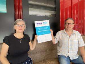 2021 06 10 co operation agreement signed BASW Chief Executive Ruth Allen and SWU General Secretary John McGowan each hold a side of the new BASW/SWU Co-operation Agreement (signed 10 June 2021) while remaining socially distanced due to COVID-19 regulations.