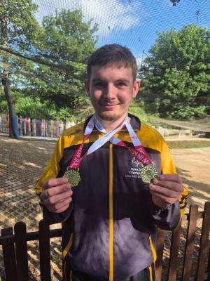 Daniel Parker with his gold medals won at the Special Olympics