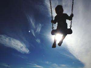 child on swing