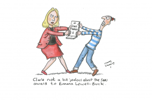 A drawing by Harry Venning with the caption "Clare not a bit jealous about the SWU award to Emma Lewell-Buck." that depicts a jealous looking Clare attempting to pry the SWU Ambassador Award plaque out of Emma's hands.