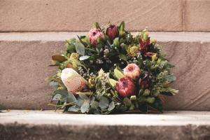ca creative kk3g6wtysfu unsplash Memorial wreath marking national mourning