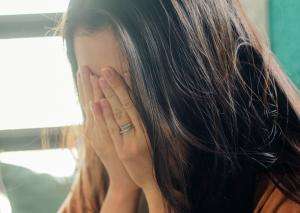 fa barboza yrb81uwkk m unsplash Woman with head in her hands