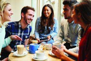 group of friends in cafe using digital devices 469160326 5147x3431 copy