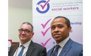 john mcgowan and jermaine ravalier working conditions John McGowan and Professor Jermaine Ravalier stand in front of a "Campaigning for better working conditions and wellbeing for social workers" poster