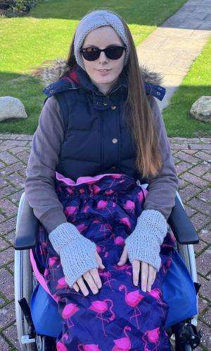 Naomi Gilchrist A young woman sits in a wheelchair