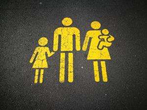 sandy millar khstxrvhfog unsplash Sandy Millar image of road sign featuring family