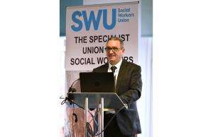 swu general secretary john mcgowan A photo of SWU General Secretary John McGowan speaking in front of a podium