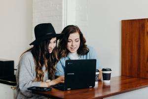 Young care leavers can access new help online Teenagers looking at a laptop