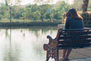 woman lonely bench sad depressed